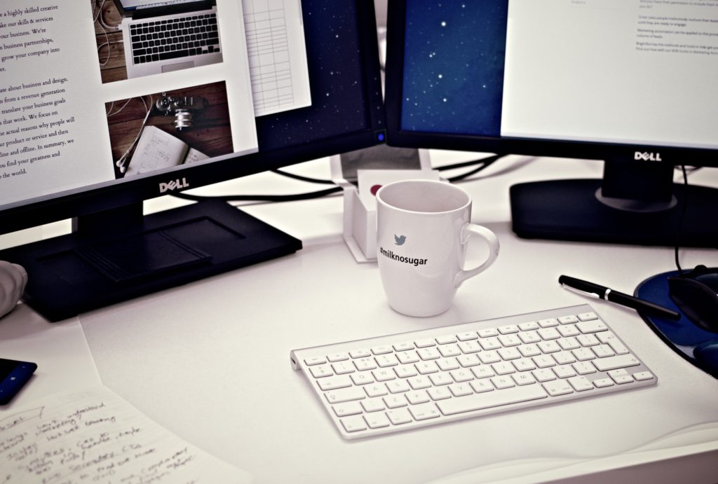 Pexels image of computer screens and a keyboard