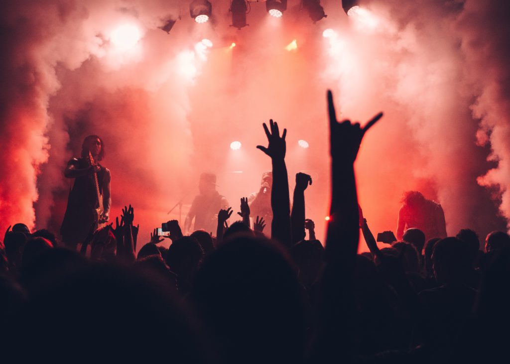 Image of a crowd watching a live performer 