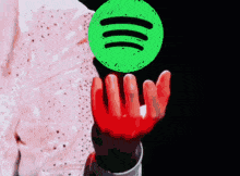 Spotify logo in hand GIF