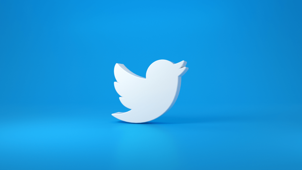 Blue background with 3D Twitter white bird logo in the middle