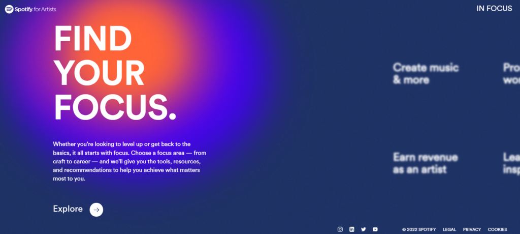 Spotify In Focus homepage. Dark blue background with an orange blurred circle following your mouse. Text about being an artist and how the site can help you.