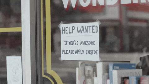 Sign on a shop window that reads 'help wanted, if you're awesome please apply inside' GIF