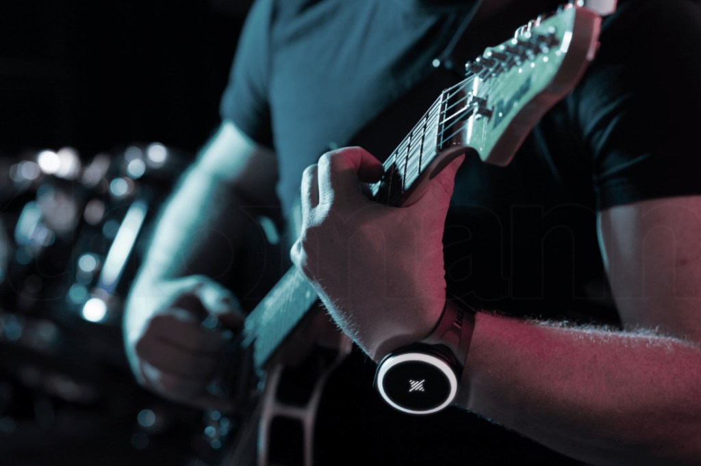 Guitarist up close shot, showing smartwatch on wrist