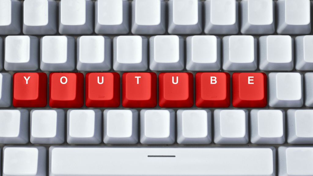 Blank keyboard with YouTube written in the middle with red keys.
