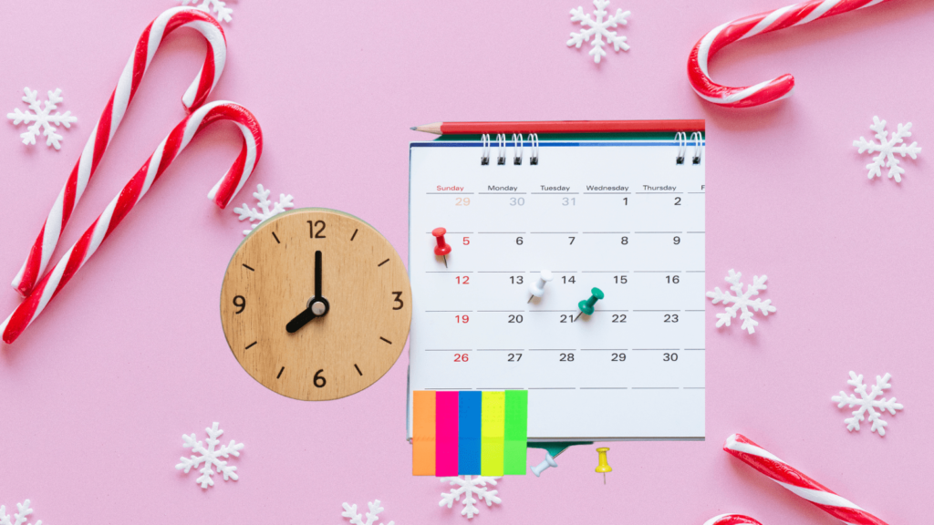 Pink snowflake background with candy canes scattered. In the foreground is a calendar with a clock.