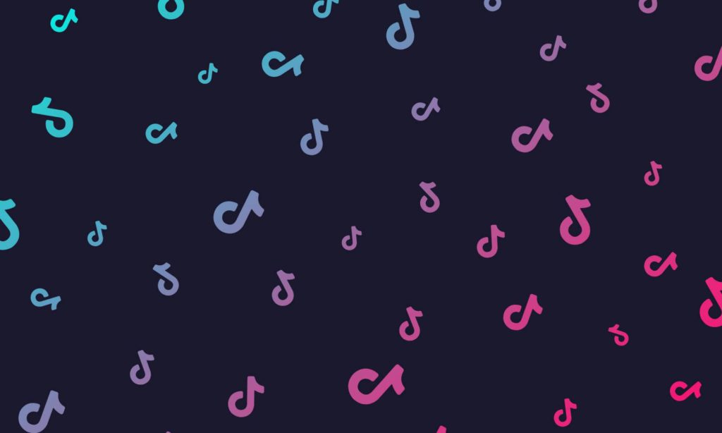 Black background covered in TikTok logos in various colours.