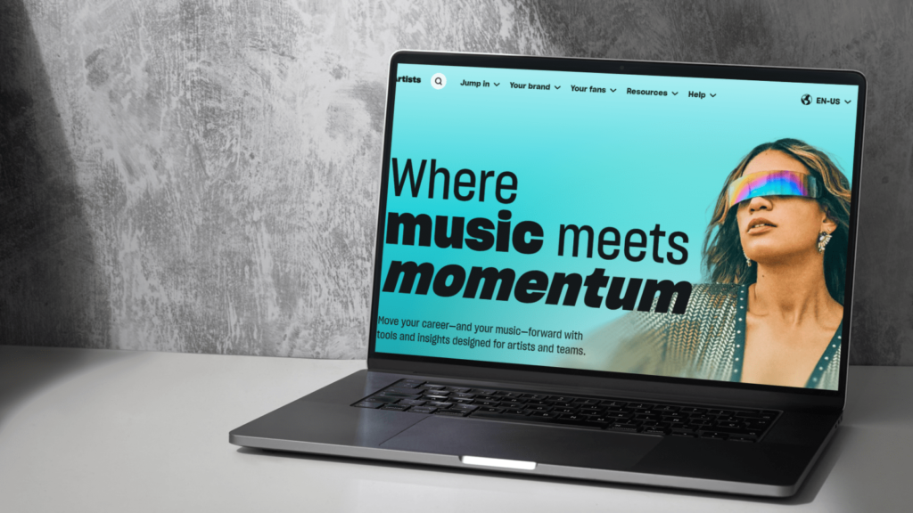 A brand-new platform Amazon Music for Artists launches. A grey background with a laptop. Loaded on the laptop is Amazon Music for Artists.