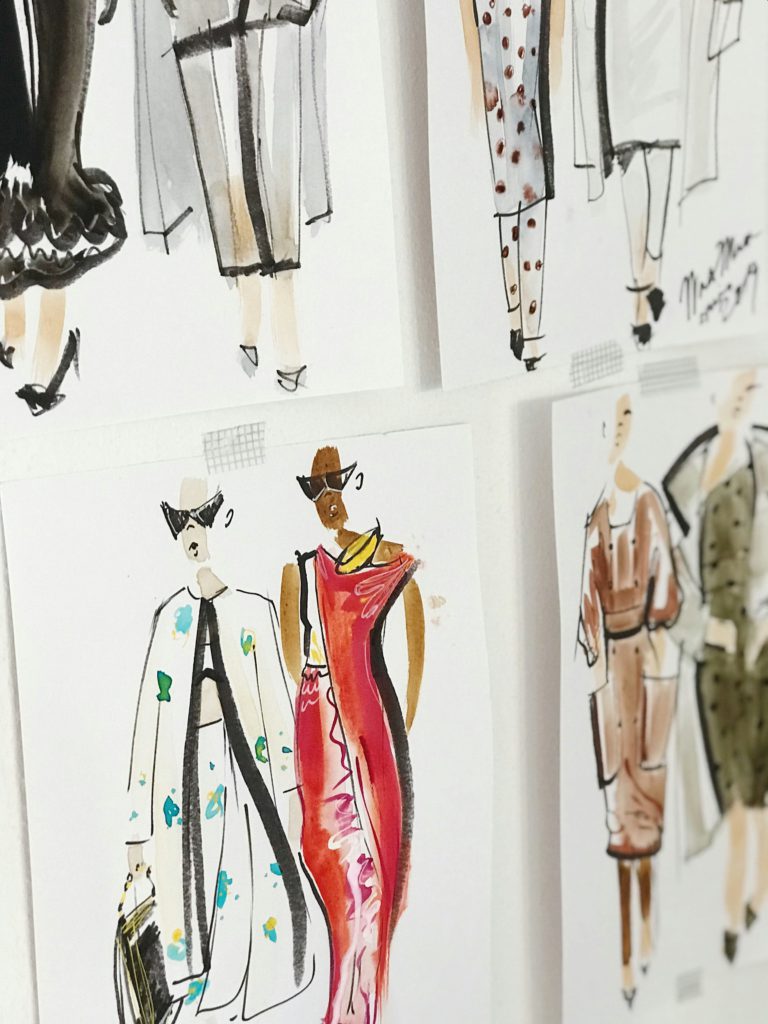 Embark on a creative journey - becoming a fashion designer. Photo of some drawings, fashion designs.