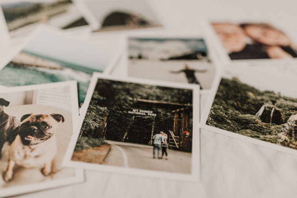 Expanding creativity - simple ways for photographers to find inspiration. Photo of multiple Polaroids scattered on a table.