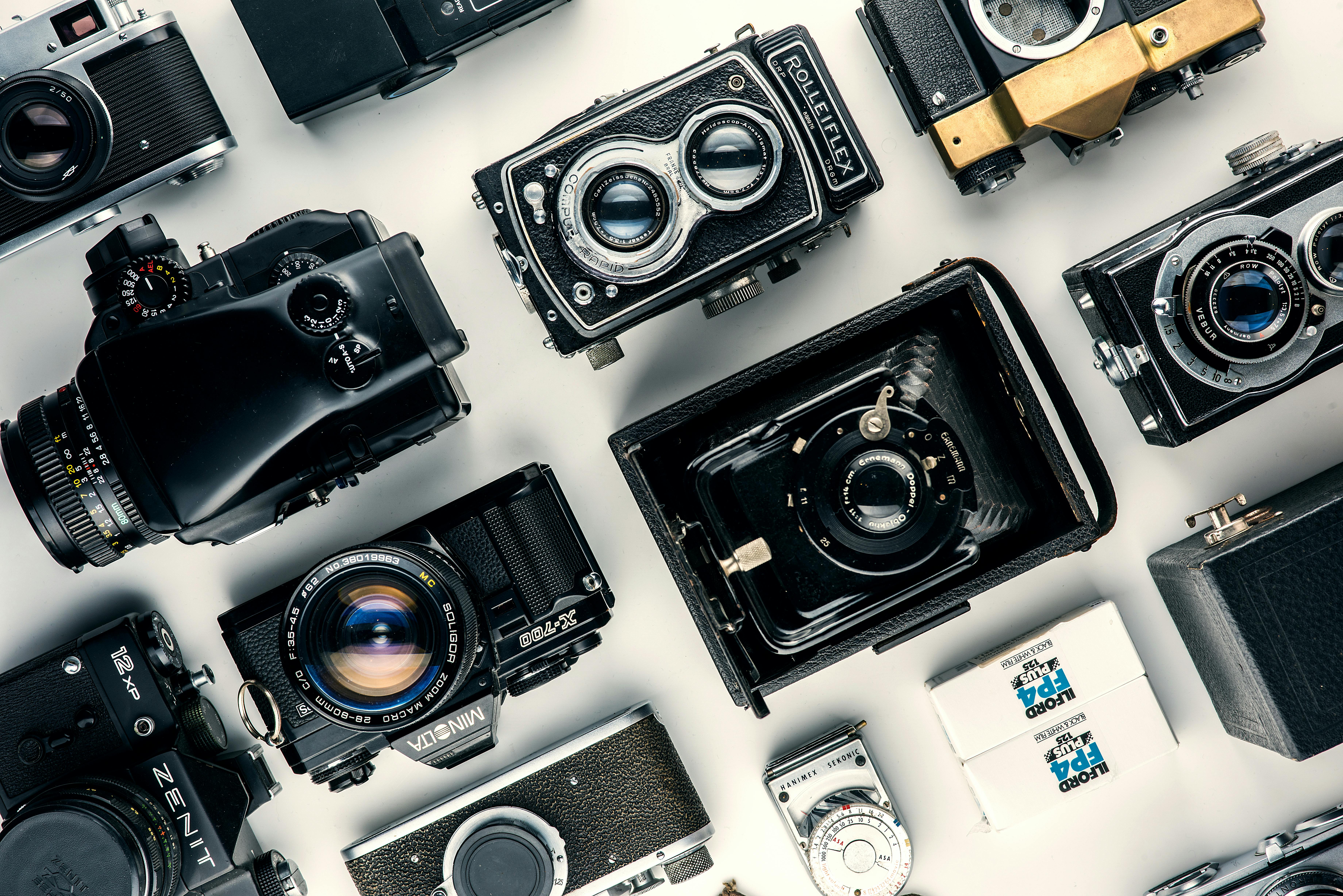 Canon vs Nikon - where did the rivalry first start? Multiple retro cameras lined up.