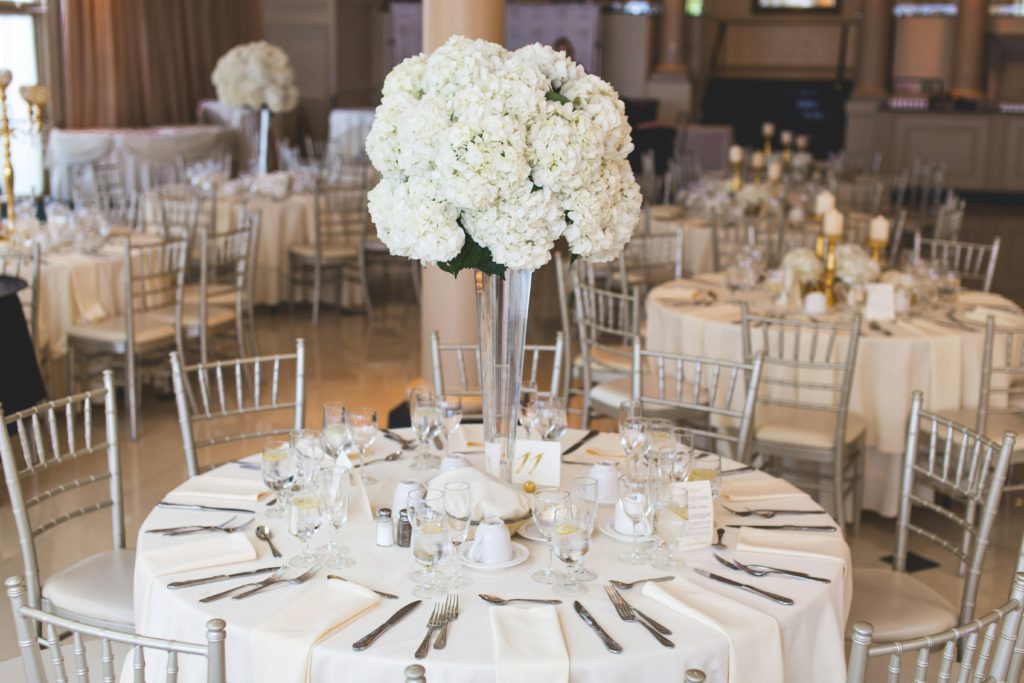 How an event planner can bring any special day to life. Photo of wedding tables set up.
