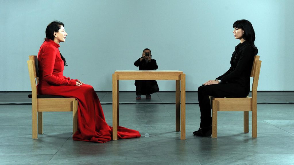 Exploring unusual artists - creativity beyond the norm. Photo of Marina Abramović in one of her most memorable art pieces.
