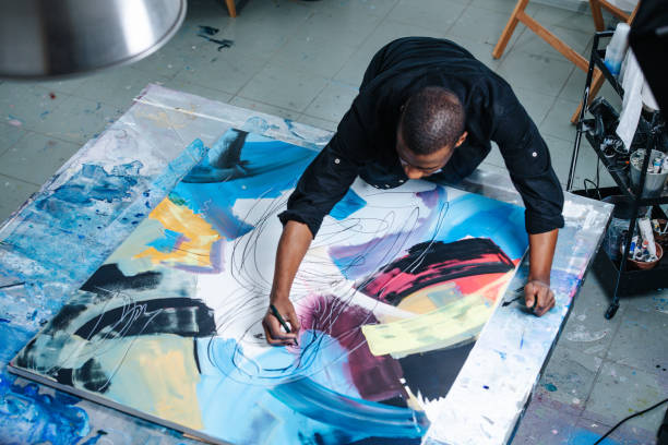 Exploring unusual artists - creativity beyond the norm. Photo of an artist creating work.