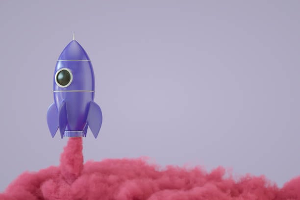 Content creation hacks - produce more content in less time. Graphic of a rocket taking off.