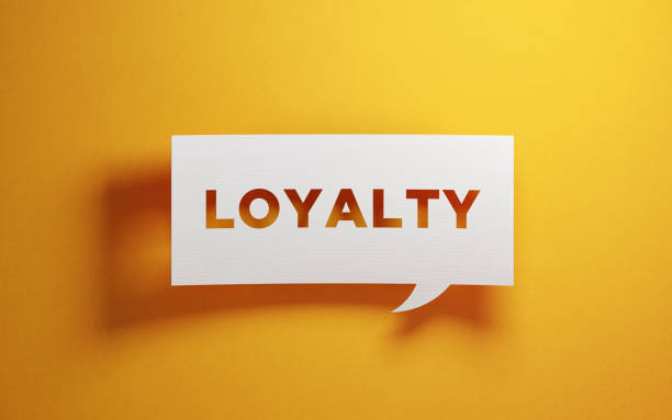 Building brand loyalty - how small brands can secure strong customer relationships. Yellow background. In the foreground is a square speech bubble saying loyalty.