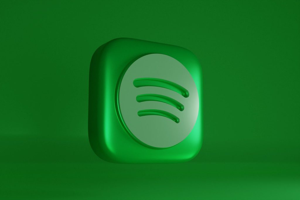 Spotify audiobook subscription - pay less, and avoid the music. Green background with Spotify 3D logo.