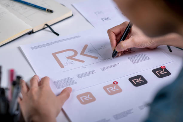 Building your brand identity - tips for beginners. Photo of someone sketching out their logo.