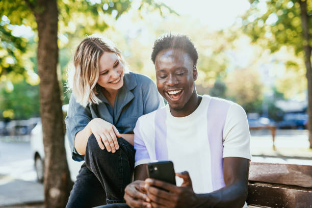 How to control the Reels you see on Facebook. Two people smiling looking 