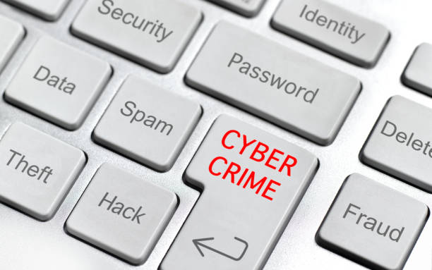 Cybersecurity tips - how to protect your personal information and stay safe online. Photo of a keyboard and the enter button says "CYBER CRIME" in red.