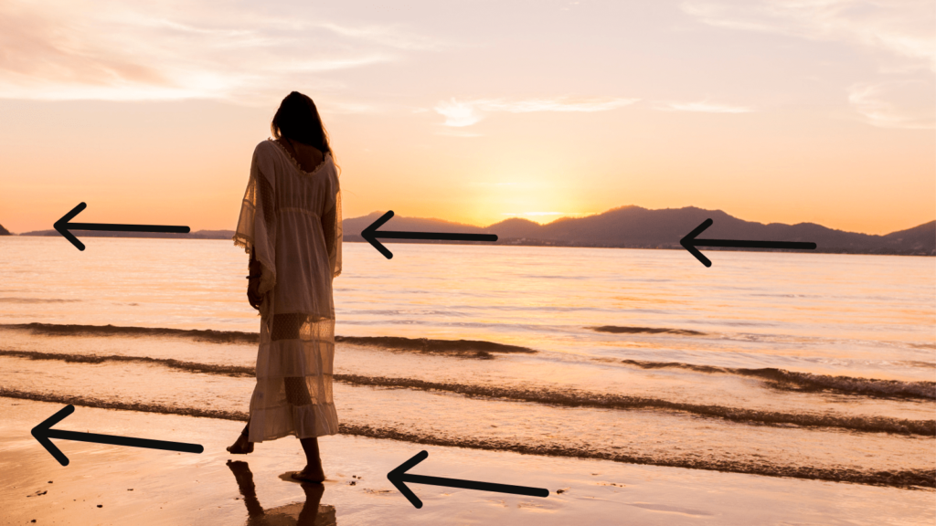 The rule of thirds and other composition techniques - elevating your photography. Leading lines shown in a photo of a woman on a beach.