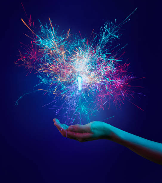 How AI can boost creativity. Sparks of colour coming from the palm of someone's hand.