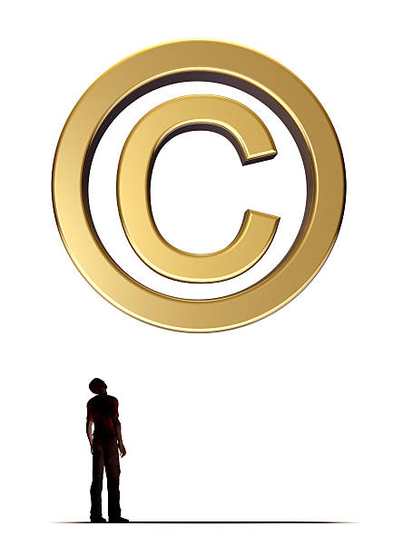 Music copyright law basics - what every artist should know. Gold C copyright symbol above a person looking up at it.