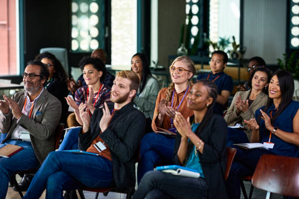 Creating for yourself vs. creating for an audience. Photo of a small audience clapping.