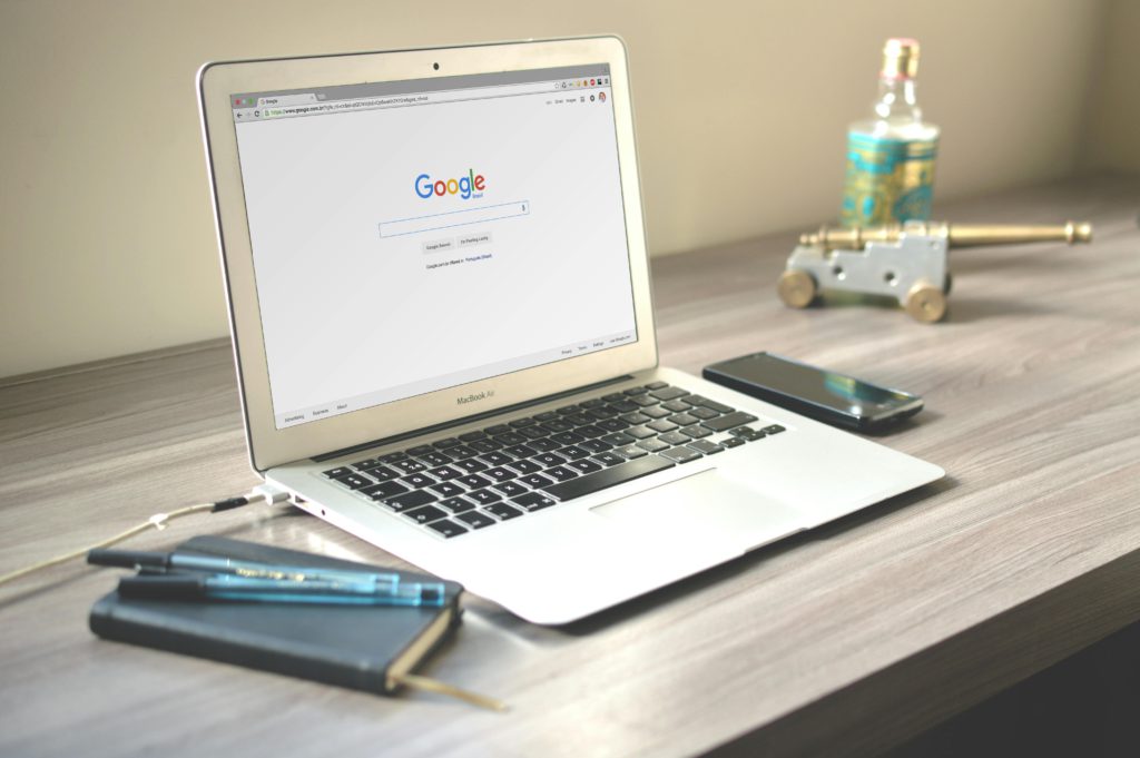 SEO tips for your next blog post. Photo of a laptop with Google loaded on a desk.