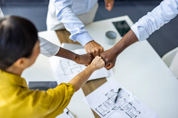 How do I get paid collaborations with brands? Photo of four people fist pumping.