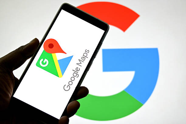How do I get listed on Google Maps? Photo of a hand holding a phone with Google Maps loaded.