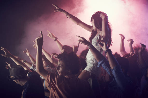 What to include in an EPK for gigs. Photo of someone on shoulders at a gig.