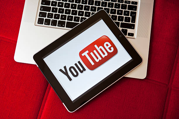 Spotify Duo replica comes to YouTube in India, France, Taiwan and Hong Kong. Photo of YouTube's logo loaded onto a tablet. Sat against a laptop.