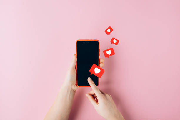 Social media feels like a full-time job — now what? Photo of a smartphone with Instagram hearts coming from it.