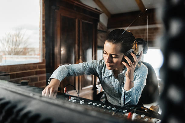 From idea to demo: my songwriting & recording workflow. Photo of a woman mixing music.