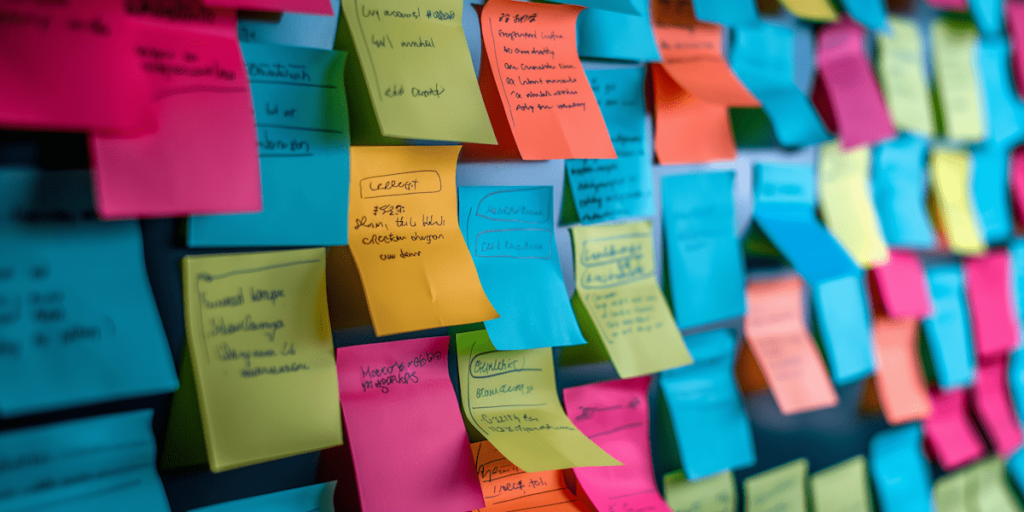 How to schedule posts on Instagram/Facebook: a simple guide for creators and small businesses. Photo of lots of sticky notes on a wall.
