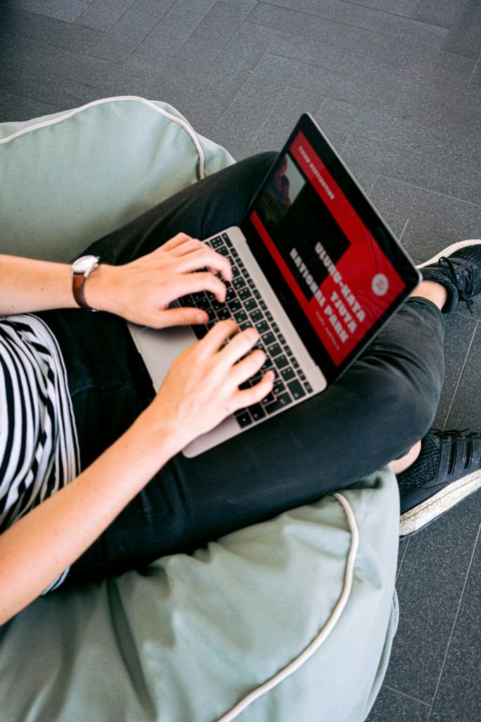 The beginner’s guide to setting up your blog on WordPress, Wix, or Squarespace. Photo of hands typing on a laptop.