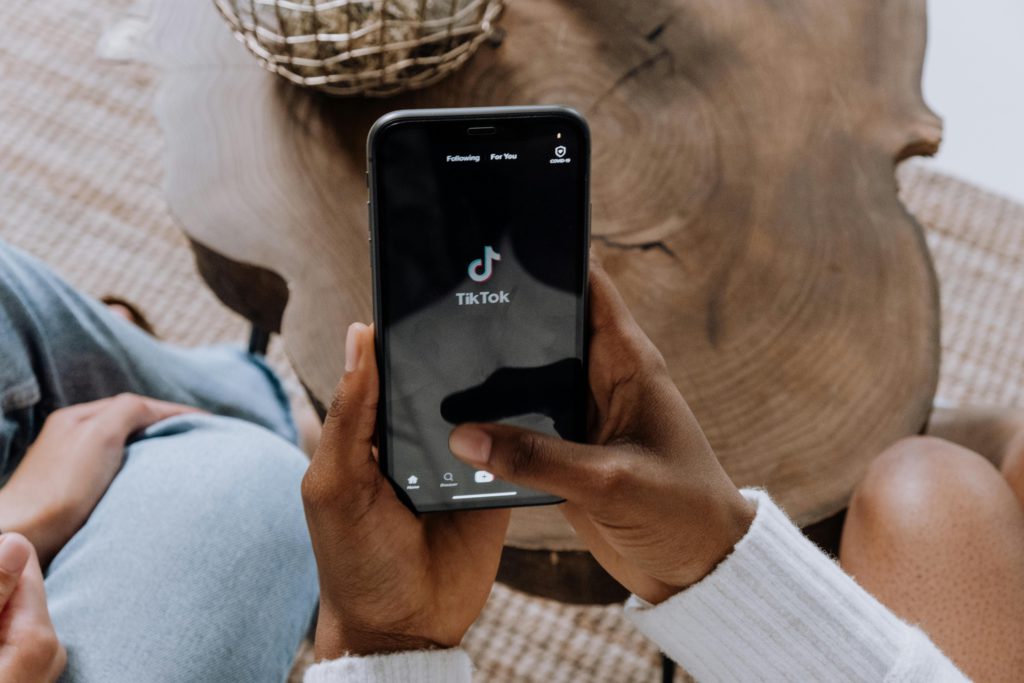 Why is TikTok not showing my videos? Photo of someone on TikTok.
