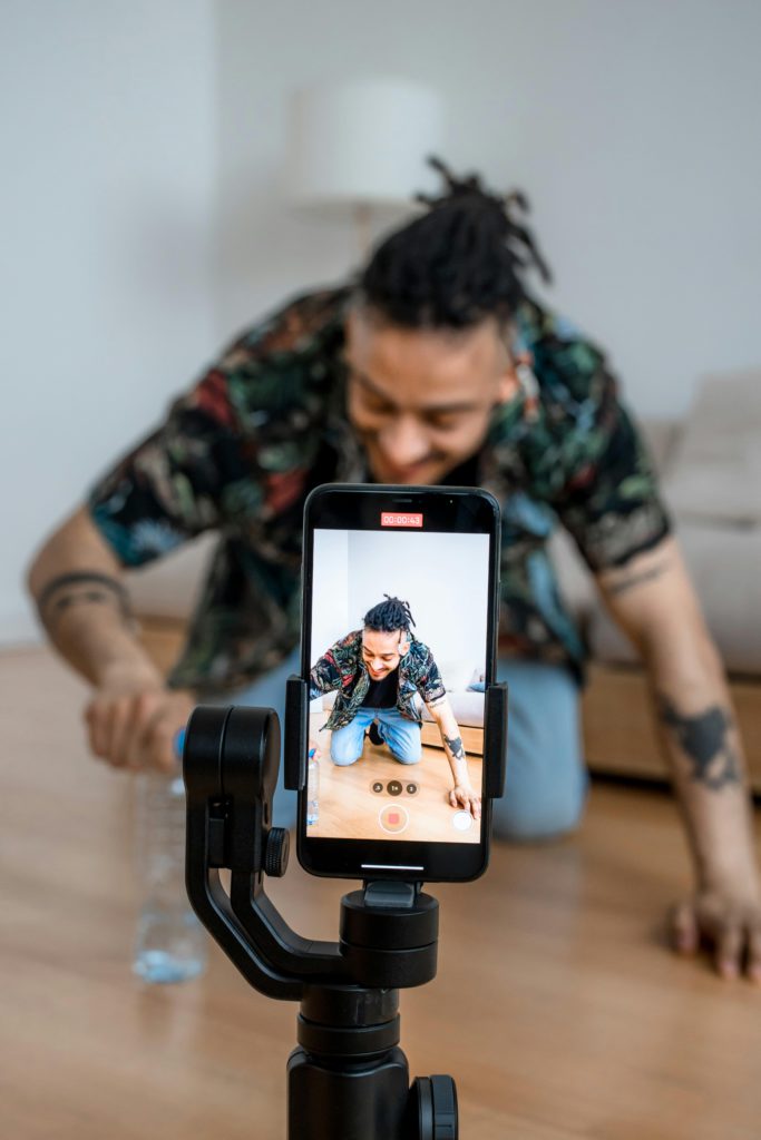 How do artists blow up on TikTok? Photo of someone recording a TikTok video.