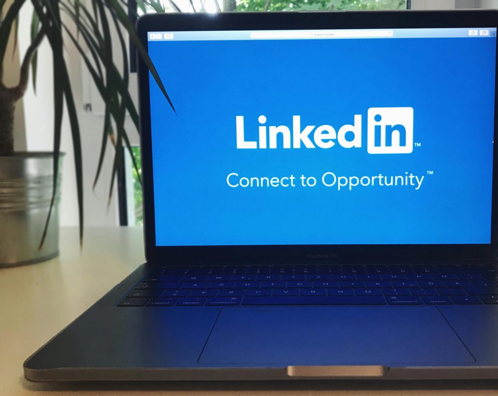 How do I schedule posts on LinkedIn? Photo of LinkedIn loaded on a laptop.