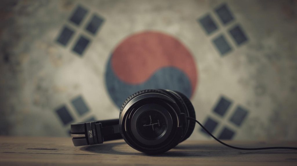 Spotify user spike in South Korea. Photo of headphones in front of a South Korean flag.