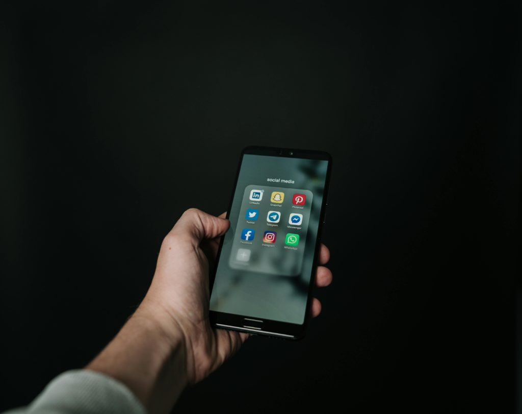 Which social media platforms should you start with in 2025? Photo of a smartphone with apps loaded.