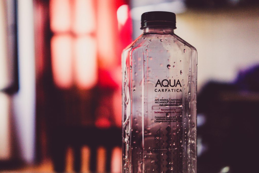DIY branding: free tools to make your social media look professional. Bottle against a blurred background.