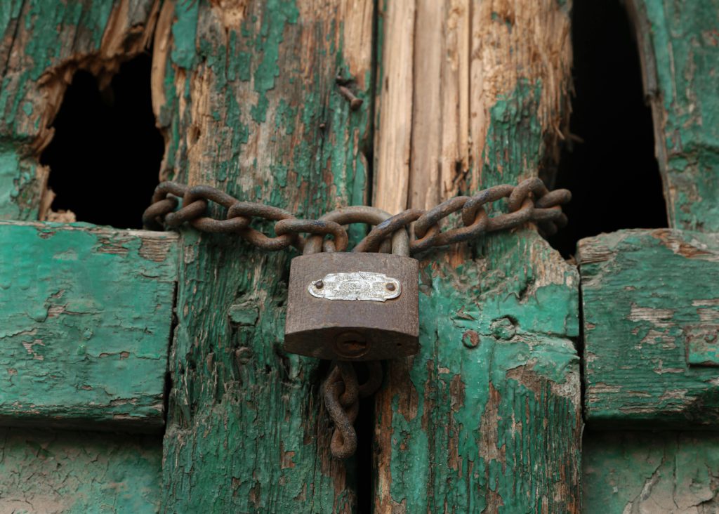 Locked out again? The most common reasons accounts get disabled. Photo of locked shed.