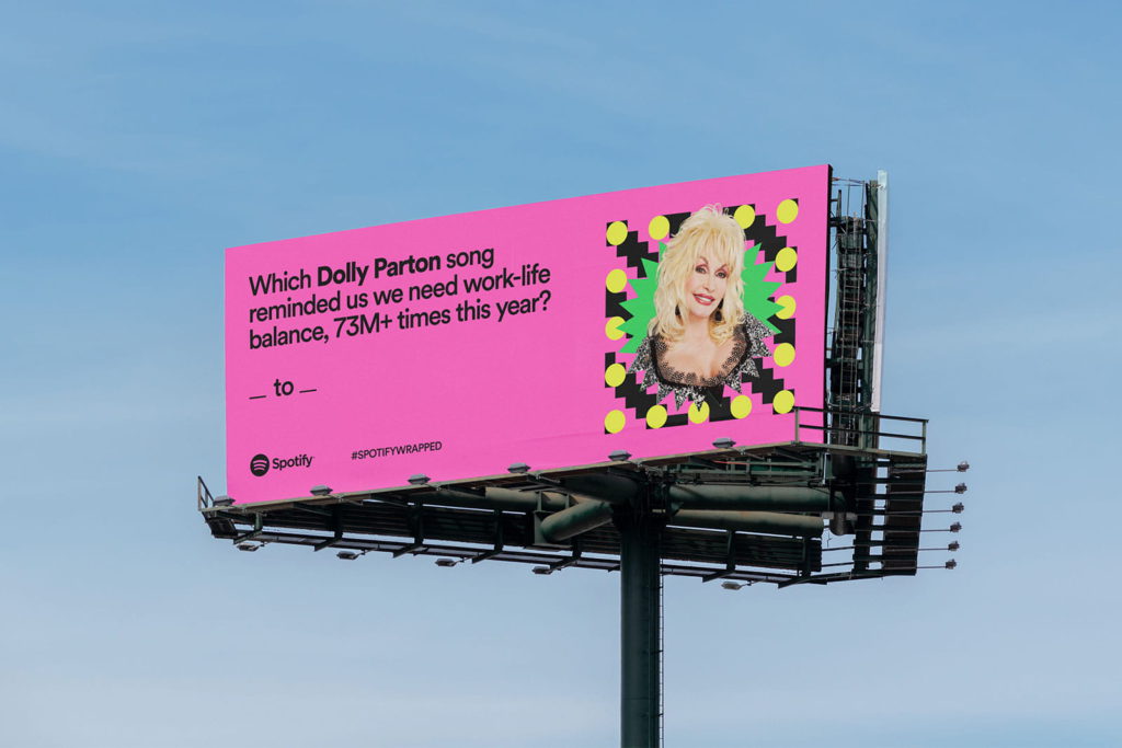 Are Spotify ads worth it for artists? Billboard with Dolly Parton on, Spotify.