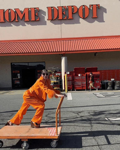 Tools every niche creator should be using. Home Depot GIF of someone rolling by on a cart.