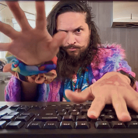 How to write captions that get people to reply (even if you have 0 followers). Man typing on keyboard GIF.